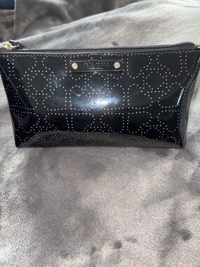 kate spade glossy black cosmetic pouch with perforated logo